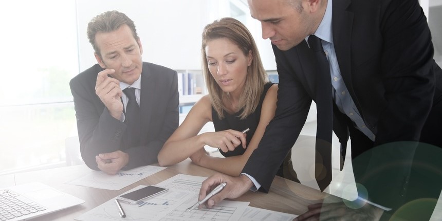 Business people looking at budget forecast
