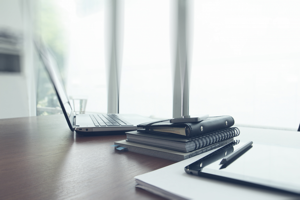 office-workplace-with-laptop-and-smart-phone-on-wood-table
